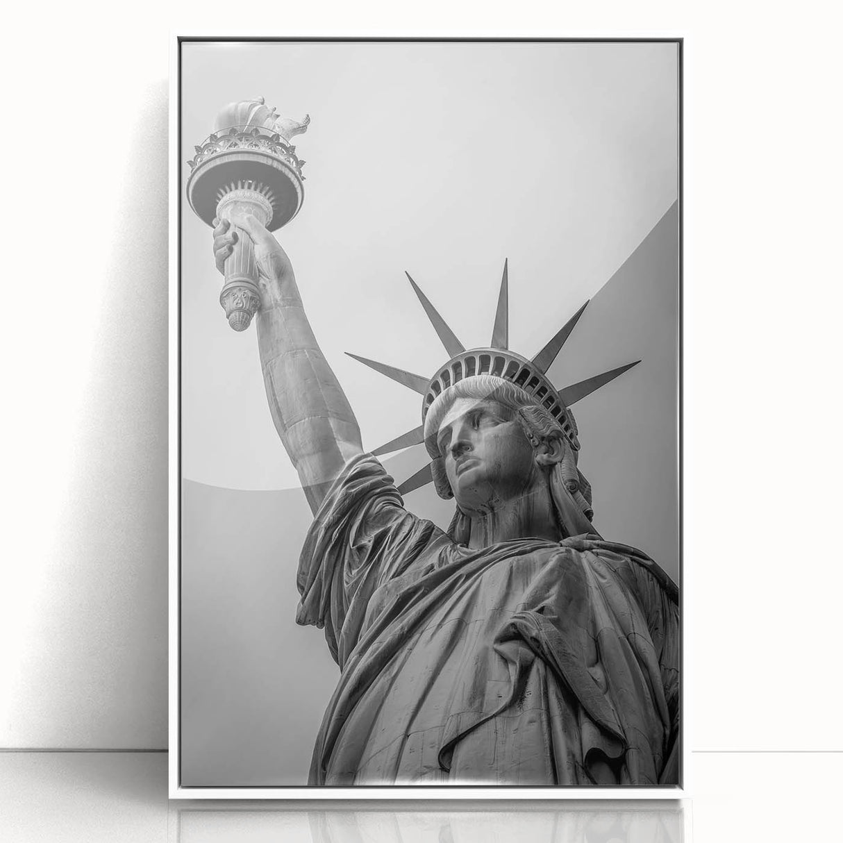 Mid-century modernist art of the Statue of Liberty in muted blue tones, acrylic print framed in white.