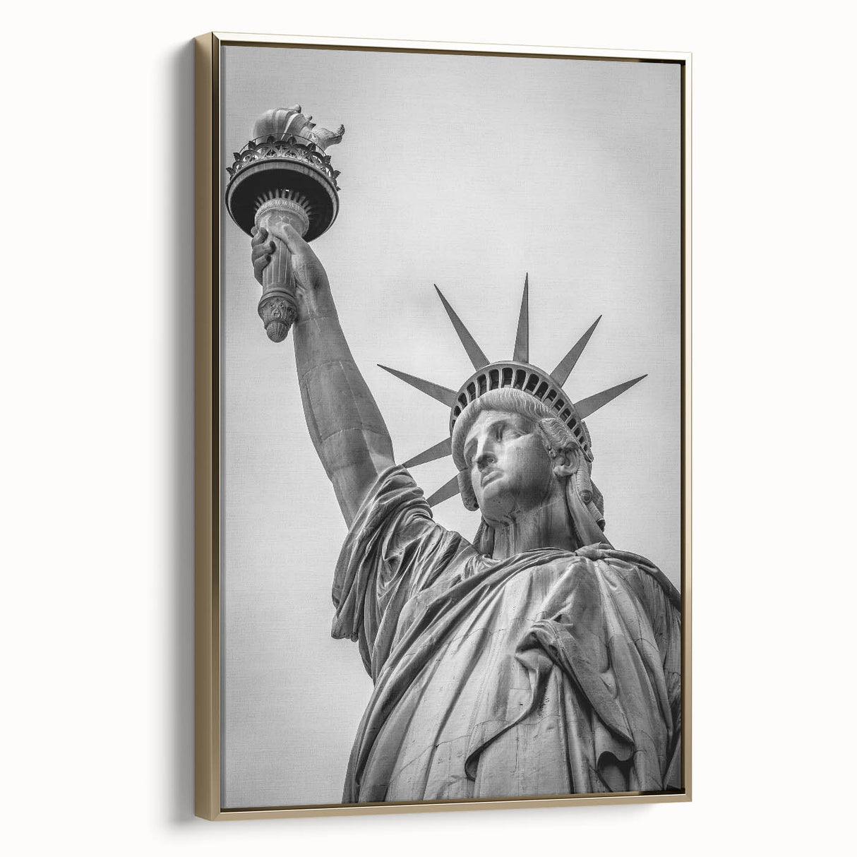 Framed canvas of the Statue of Liberty in black and gold tones, ideal for bedroom wall art.
