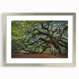 Textured abstract art print of Charleston scenery in muted earth tones, framed in silver, ideal for bedroom wall decor.