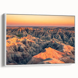Vintage poster art of South Dakota Badlands in black frame, featuring vibrant earth tones, ideal for living room decor.