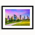 Extra large abstract art print of Houston skyline in colorful, textured tones on a framed black mat.