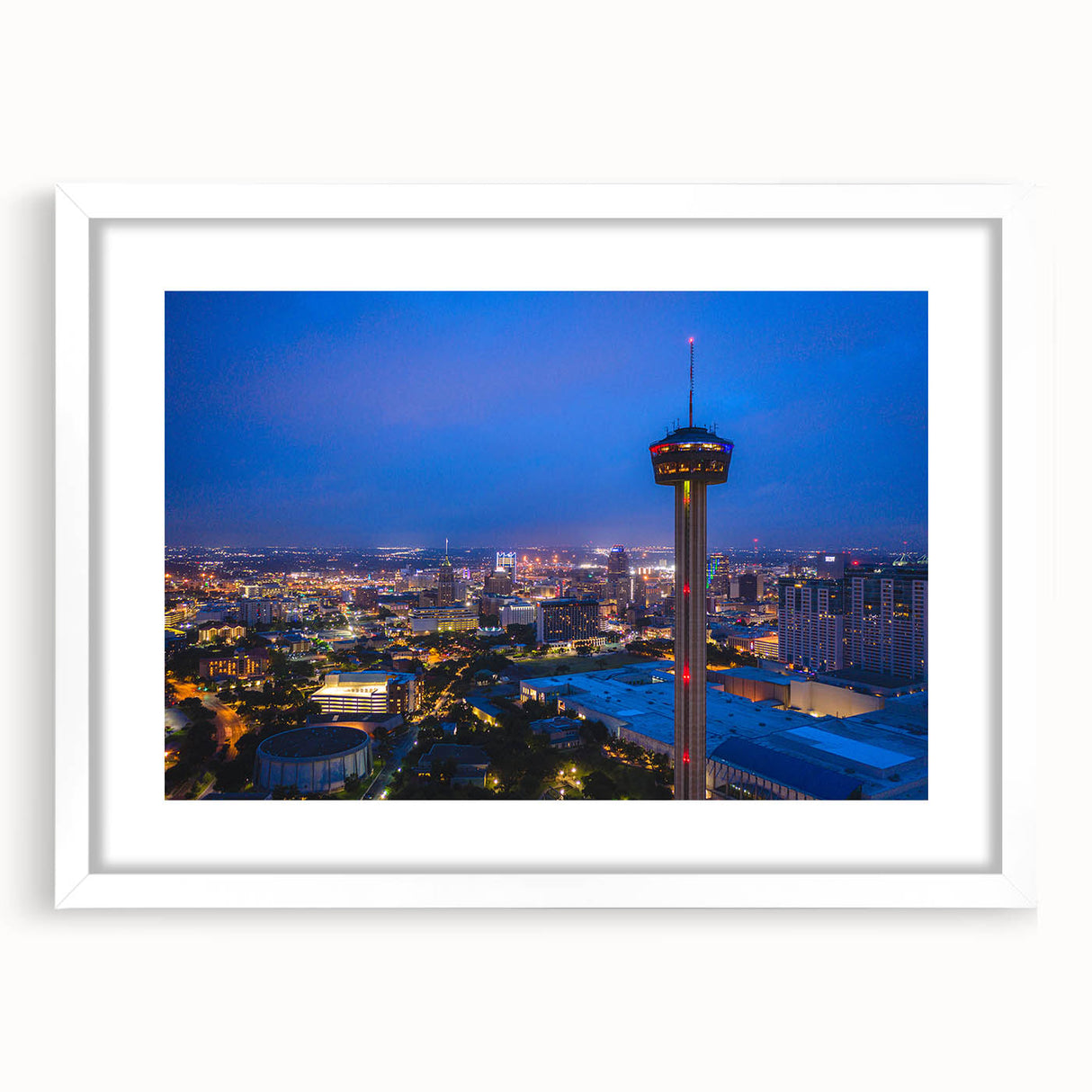 Abstract art print of San Antonio skyline in muted blue and gray tones on a white-framed matte canvas.