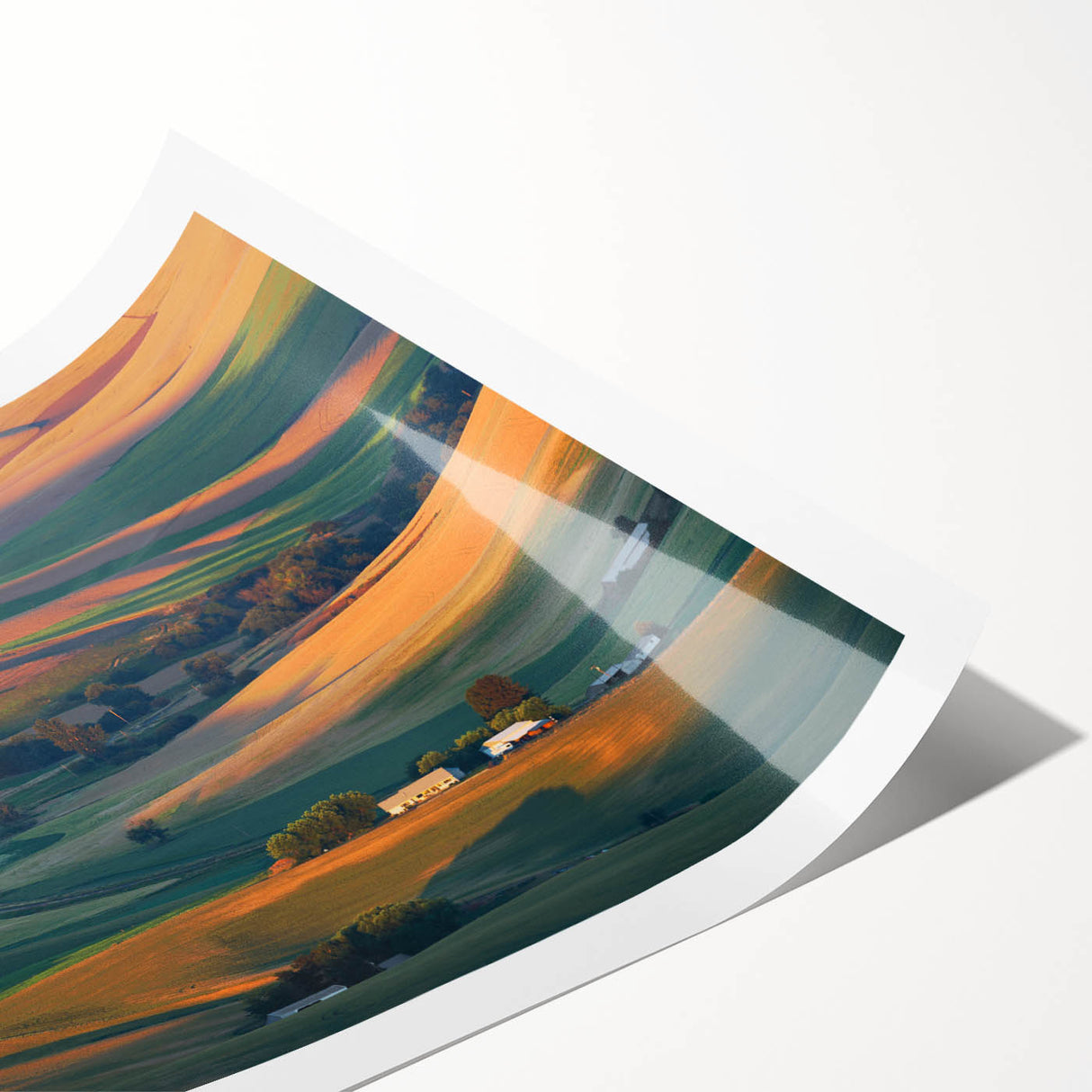 Rolled print of the Palouse scenery in Washington featuring expansive green fields under a cloudy sky.