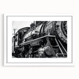 Abstract art print featuring assorted vibrant vehicles on a white background, framed in white.