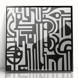 Framed abstract geometric art piece with a black acrylic front, showcasing intricate patterns and vivid colors, ideal for modern home decor and artistic interiors.