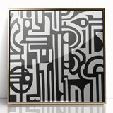 Framed abstract geometric wall art in gold tones, showcasing a modern design with sharp angles and a sleek acrylic finish, perfect for contemporary decor.