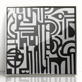 Abstract geometric design framed in sleek acrylic with a silver finish, showcasing sharp angles and vibrant colors, perfect for modern home decor accents.