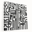 Abstract geometric stretched canvas artwork showcasing vibrant colors and bold shapes, displayed in a side view to highlight its depth and texture, ideal for modern decor.