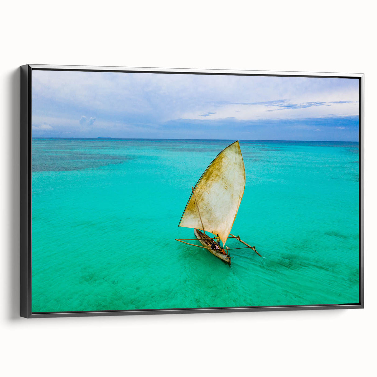 Black and white wall art featuring a vintage poster-style landscape of Madagascar on a framed canvas.