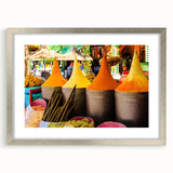 Abstract art print depicting a Moroccan landscape in muted earth tones on a framed silver mat.
