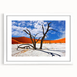 Extra large textured abstract art print of an African scenery in muted earth tones, framed with a white mat.