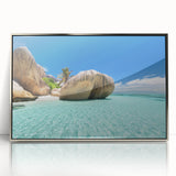 Mid-century modernist art depicting the Seychelles landscape in vibrant colors on a silver-framed acrylic.