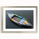 Textured art print depicting an abstract scenery in muted earth tones, framed with a silver mat, suitable for bedroom art.