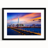 Colorful abstract art print of Seoul skyline with vibrant hues on a textured, extra large canvas, framed in black.