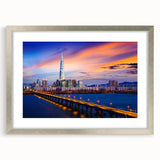 Textured art print of abstract Seoul skyline in muted gray and silver tones, framed in silver, ideal for bedroom decor.