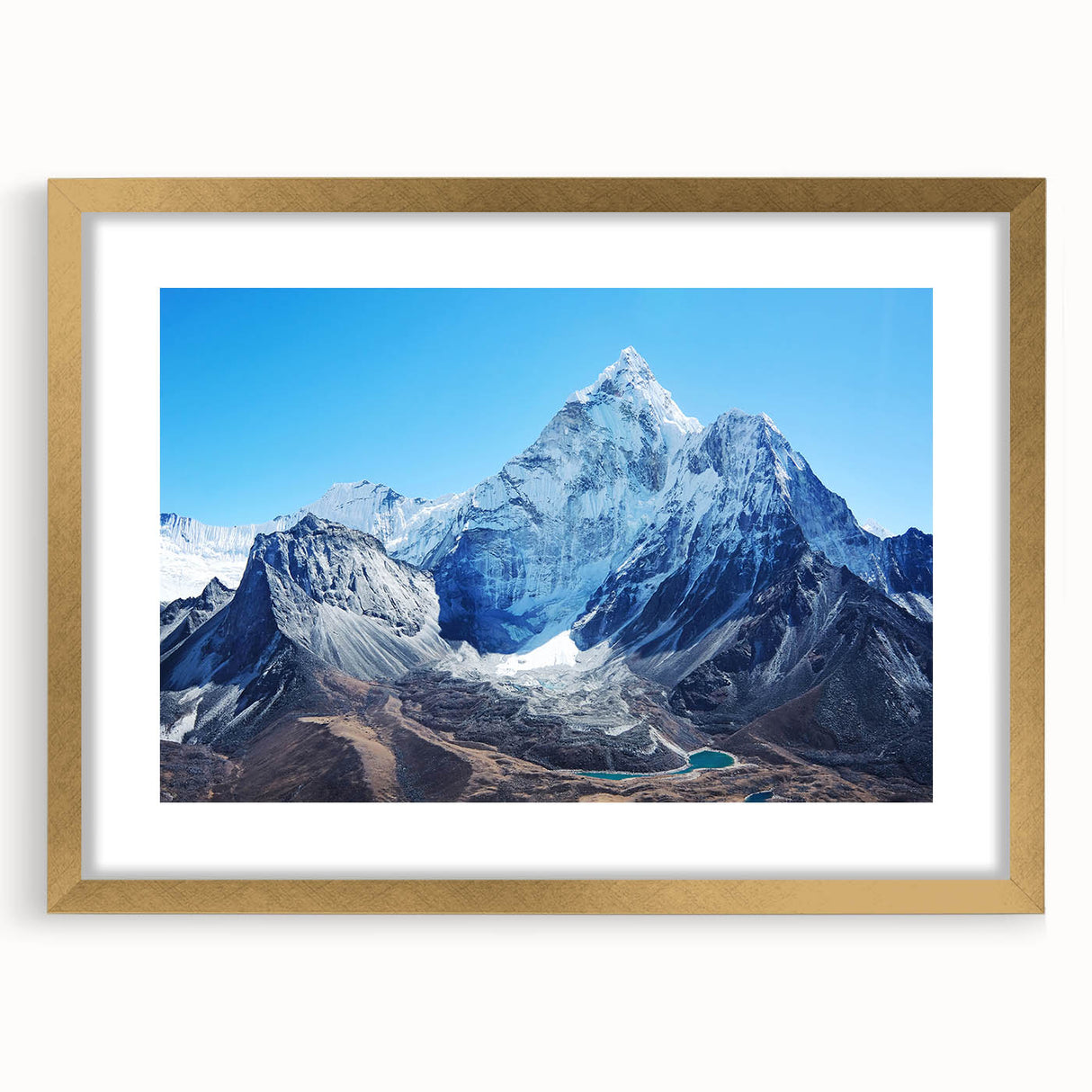 Extra large wall art featuring an abstract depiction of Mount Everest in textured gold and blue tones, framed with a mat.