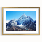 Extra large wall art featuring an abstract depiction of Mount Everest in textured gold and blue tones, framed with a mat.