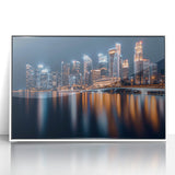 Acrylic print of Singapore skyline in muted gray and blue tones, framed in white, suitable for modern art wall decor.