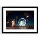 Abstract art print of colorful, textured scenery, framed in black, ideal for living room decor.