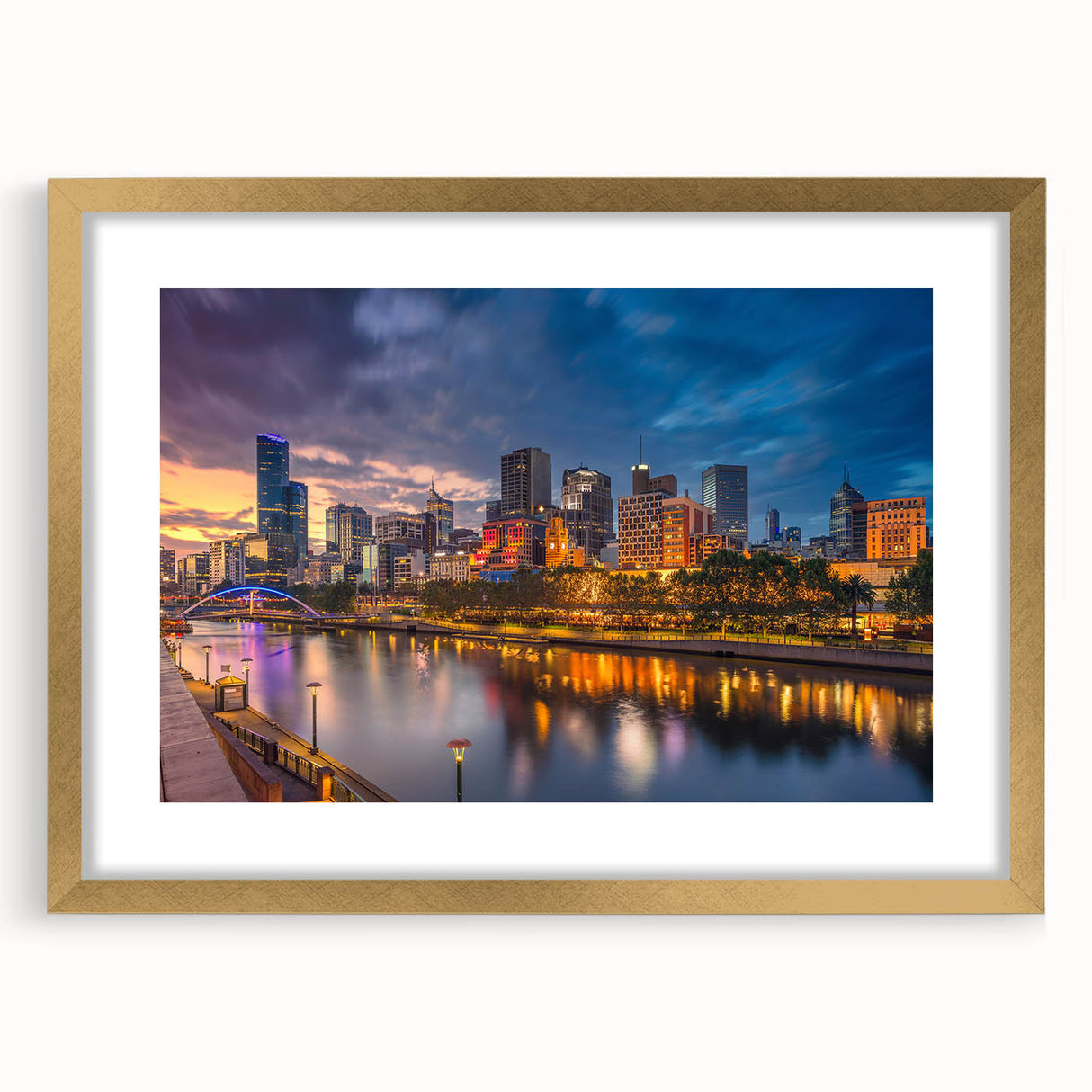 Textured abstract art print of Melbourne skyline in gold frame, with muted earth tones, ideal for bedroom art.
