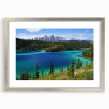 Textured abstract art print of a Yukon scenery in muted earth tones, framed in silver, suitable for bedroom decor.