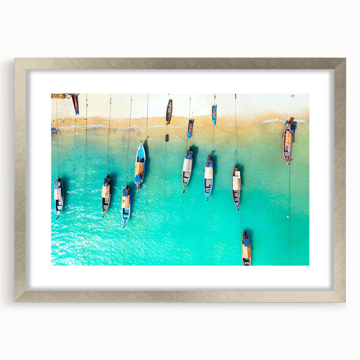 Extra large abstract art print of Caribbean scenery in vibrant blue and green tones on a silver-framed canvas.