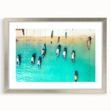 Extra large abstract art print of Caribbean scenery in vibrant blue and green tones on a silver-framed canvas.