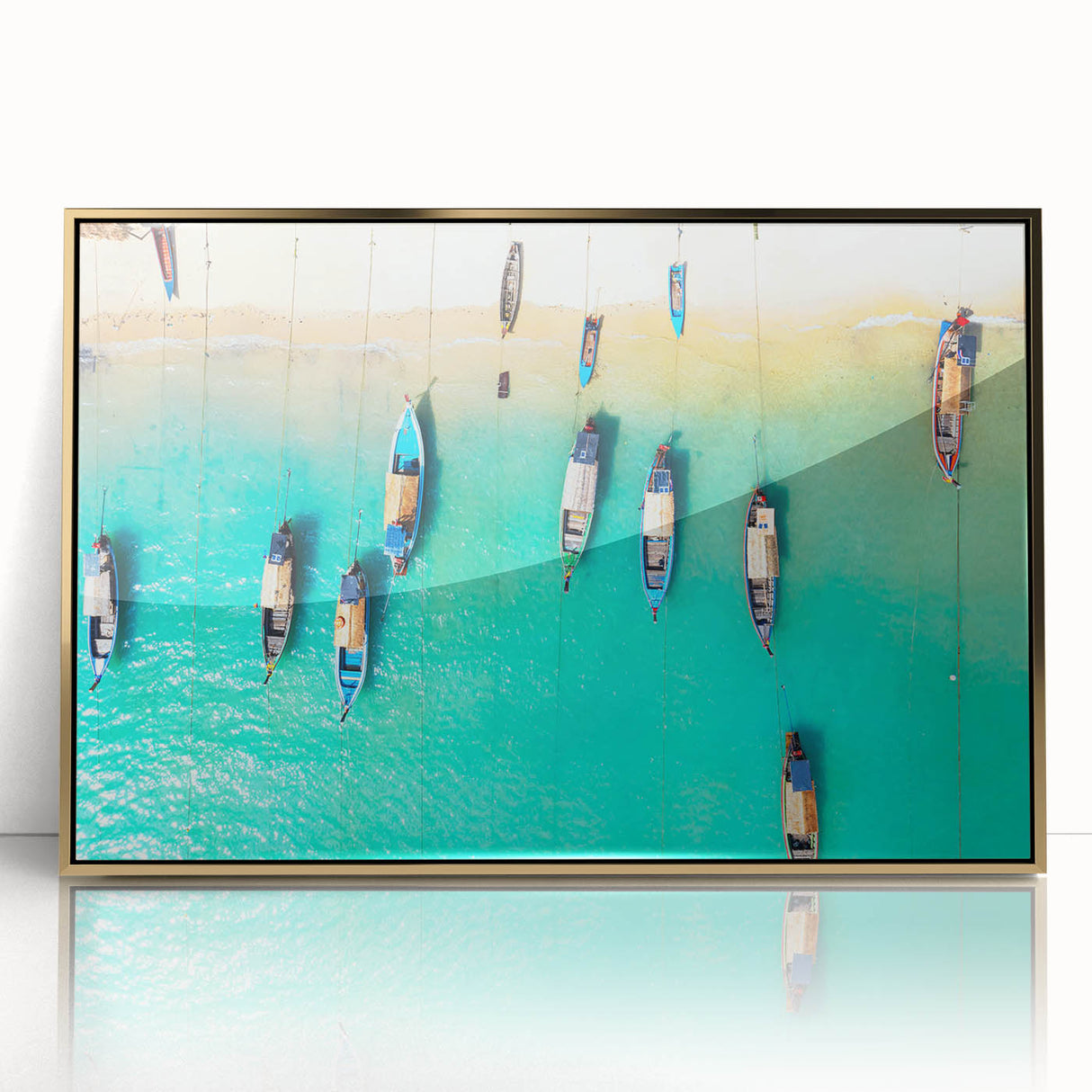 Art deco poster of Caribbean scenery in acrylic, framed in gold, featuring vibrant ocean blues and greens.