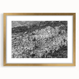 Abstract art print of a Caribbean landscape in gold frame, featuring muted green and blue tones, ideal for dining room decor.
