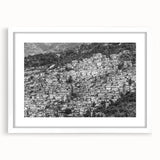 Textured abstract art print of Caribbean scenery in muted blue and green shades on a framed white mat.