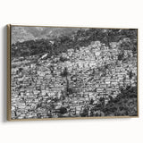 Framed canvas featuring a vintage-style landscape painting of the Caribbean in Haiti with lush greenery and ocean views.