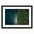 Abstract art print of a vibrant Costa Rican landscape in a black frame, ideal for living room decor.