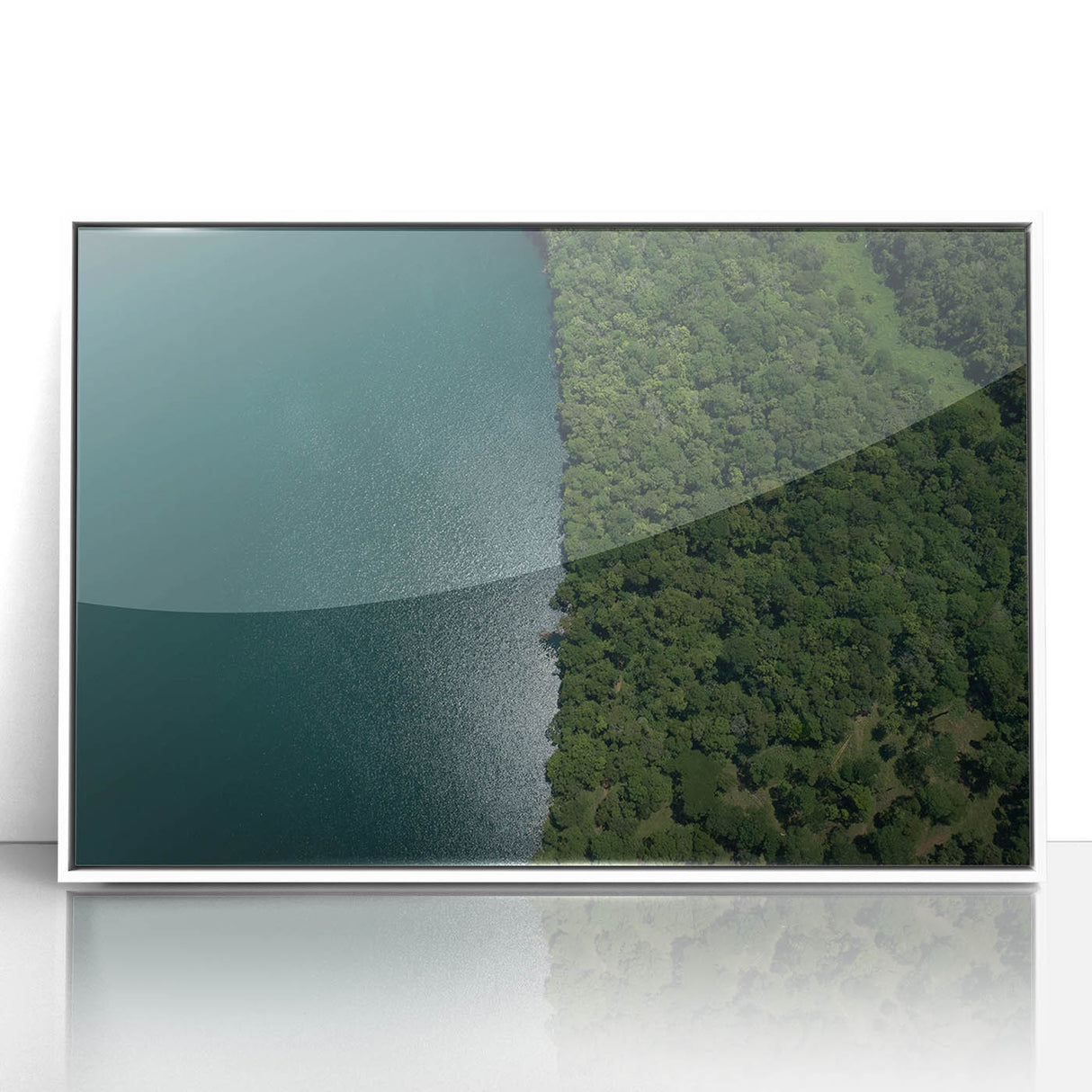 Acrylic print of a Costa Rican landscape in muted green and blue tones, framed in white, suitable for modern nursery decor.