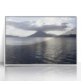 Art deco poster featuring a tranquil Guatemalan landscape in pastel hues, framed in white acrylic.