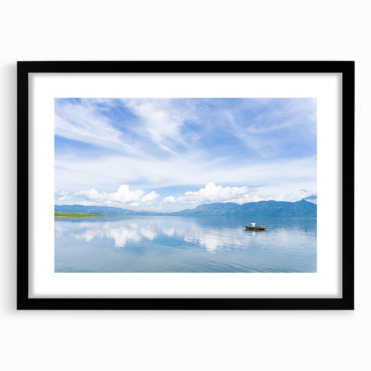 Abstract art print depicting a textured, colorful Central American landscape on a large black-framed canvas.