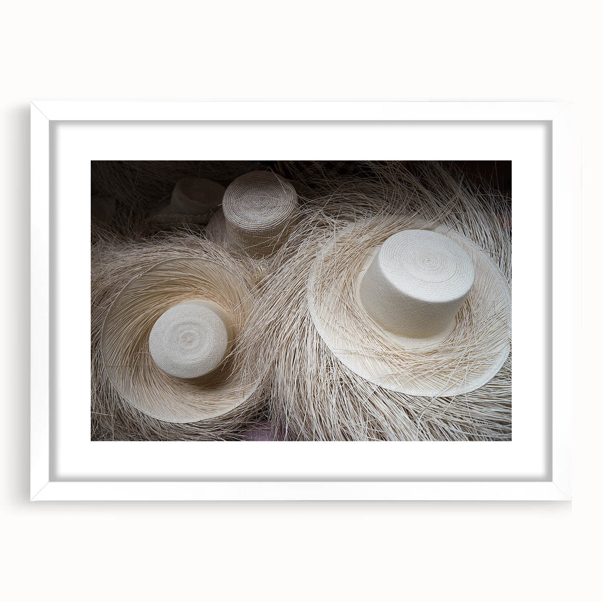 Abstract art print depicting a colorful Central American scenery on a framed white mat, ideal for dining room decor.