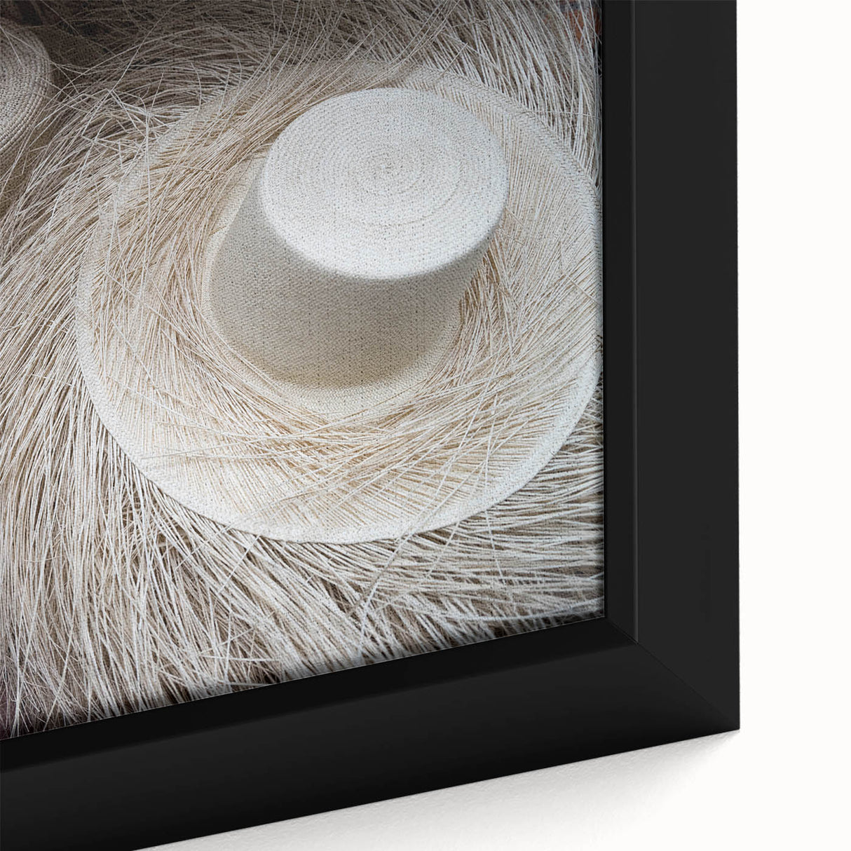 Close-up of a black framed canvas depicting a colorful, textured Central American landscape, ideal for living room decor.