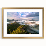 Abstract art print of a European cityscape in muted gold and gray tones, framed with a gold mat, ideal for dining room decor.