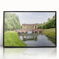 Large abstract wall art depicting a European scenery in muted earth tones on a framed acrylic.