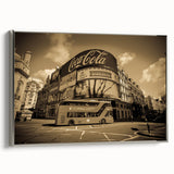 Framed canvas of a vintage-style Piccadilly Circus landscape painting, featuring vivid colors on black background.