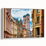 Vintage poster art of Munich on framed canvas, featuring colorful elements on a black background.