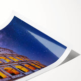 Extra large wall art of the Colosseum in muted earth tones on a rolled canvas, suitable for large living room decor.