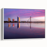 Vintage poster art of a scenic European landscape in vibrant colors on a framed canvas, ideal for living room decor.