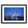 Abstract art print featuring a colorful, textured depiction of a European scenery, framed in black.