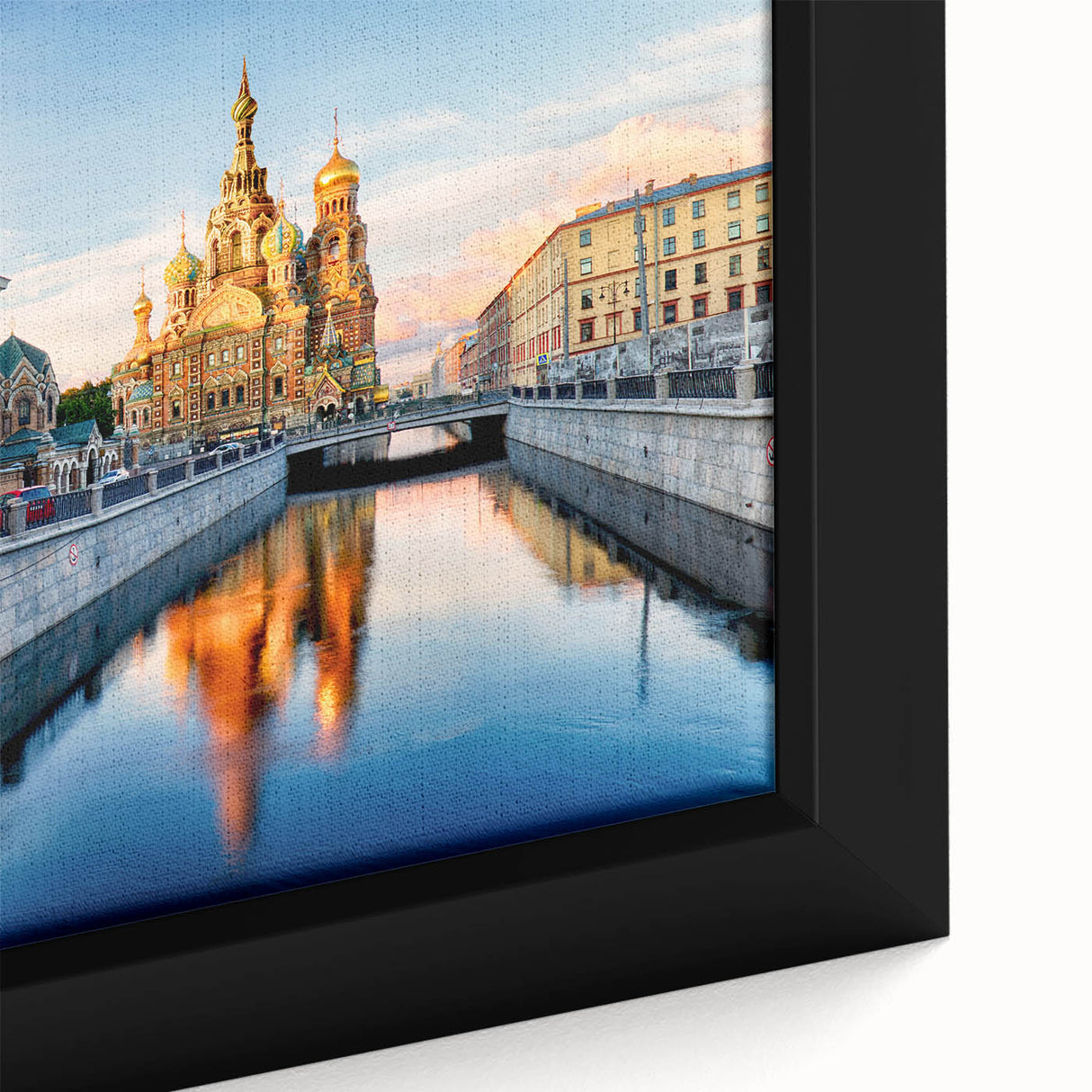 Extra large framed canvas featuring a textured depiction of a European cityscape in black with colorful accents.