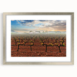 Textured art depicting an abstract European scenery in muted earth tones, framed with a silver mat.