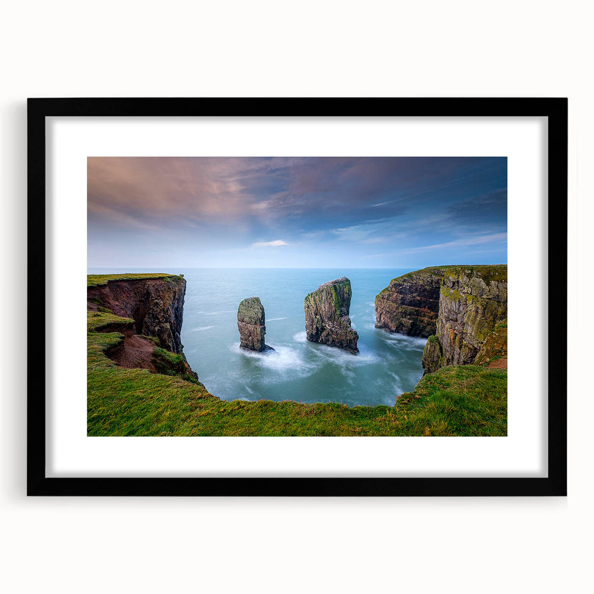 Extra large abstract art print of a colorful, textured Welsh landscape in a black frame, ideal for living room decor.