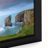 Black wall art featuring a textured, colorful depiction of a Welsh landscape on a framed canvas, ideal for living room decor.
