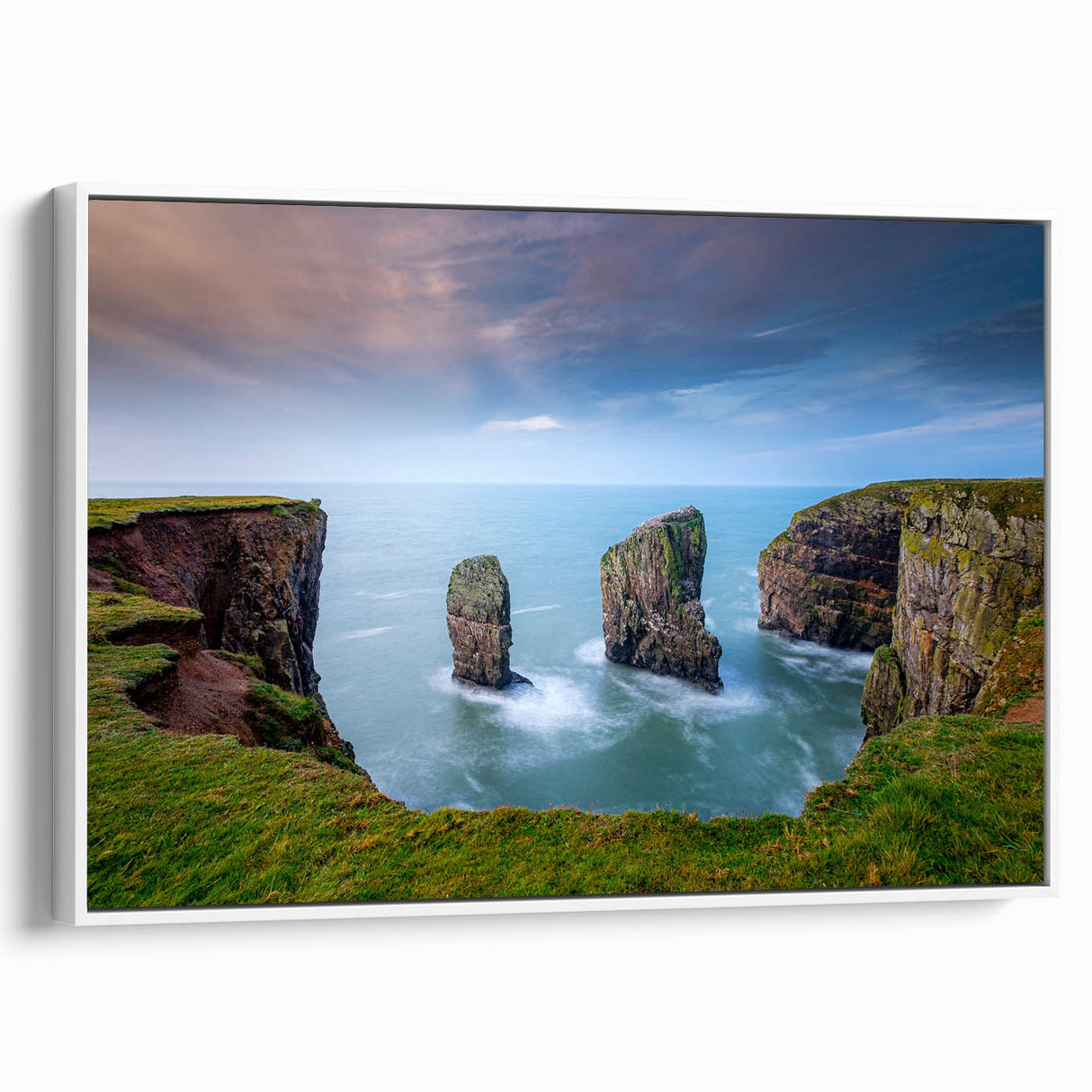 Vintage poster art of a Welsh landscape on a framed canvas, featuring vibrant green and blue tones.