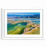 Abstract art print of Oaxaca scenery in muted earth tones on a framed white mat, suitable for bedroom or dining room decor.